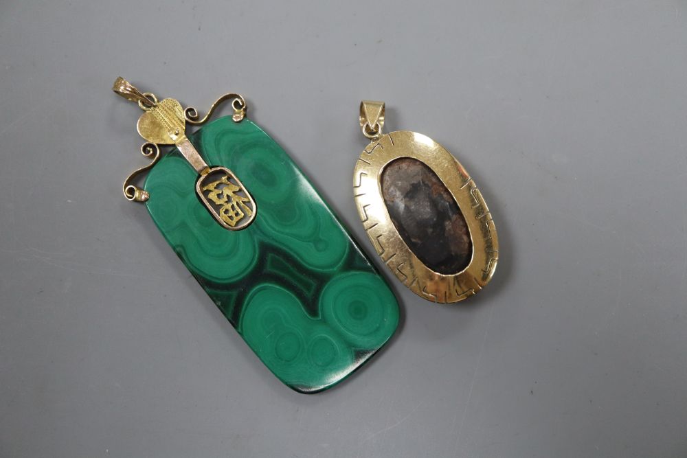 A 14k yellow metal mounted turquoise oval pendant, 36mm, gross 9.2 grams and a Chinese 14k & malachite pendant.